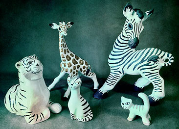 Gus McLaren Potter, designed animals, zebra, lion, cat and giraffe. McLaren Pottery