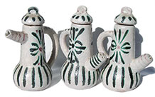 3 pottery salt and pepper shakers and sauce bottle