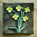 Green flower tile with yellow petals 